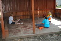 Linda and Susanna play ball with little Dima.