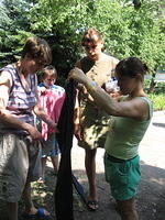 Girls look at clothing and the personal care bags.