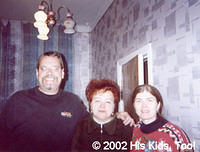 His Kids, Too! Director Teresa Fillmon, and Assistant Director Rich Fillmon, pose with their friend and local Internot Director.