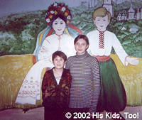 Two orphans at the local internot pose in front of this beautiful Ukrainian painting.