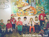 At the local Orthopedic Hospital, Alla and Artur pass out gifts to all the children