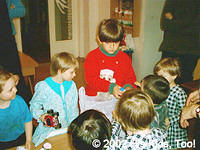 Artur passing out toys to the kids.