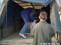 Vanya loads grain at the market