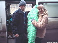 His Kids, Too! volunteer, Dima and Christina unload new mattresses for the cribs.