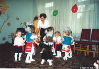 In full traditional Ukrainian costume, these orphans perform a dance saying 'good-bye' to fall, welcoming winter.
