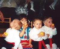 For their wonderful performance children are treated with fruit and candies.