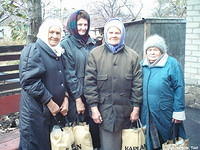 These dear sisters of the church, were thrilled to have this much needed food.