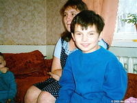 Sergey shows his joy for his new warm cothing.