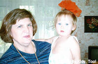 His Kids, Too! on site missionary and board member, Lynn, holds this little girl on her way for her afternoon nap.