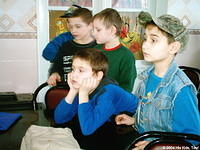 These boys anxiously wait their turn for receiving clothing.