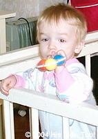 She enjoys her new rattle.