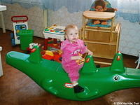 This little girl enjoys the see-saw.