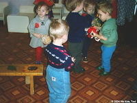 The kids are enjoying trading and playing with the distributed toys.