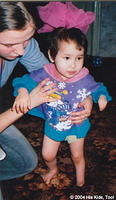 Though she has some difficulty, Margarite is able to walk.