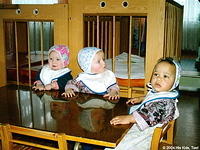 These handsome children patiently wait for their lunch.