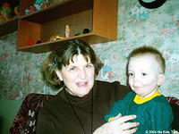 His Kids, Too! board member Lynn A. holds this precious boy.