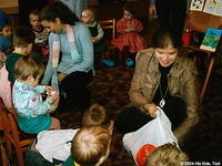 His Kids, Too! director hands out toys to the waiting children.