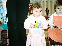 Alina loves her new toy, she is such a happy child.