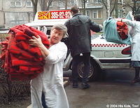 Ladies joyfully carry the blankets in the hospital even though it was 6 flights up to the ward