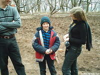 His Kids, Too! board member, Ray, and volunteer Christina speak with Victor.