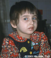 Compelling eyes reflect the caution and concern of the camera-shy.