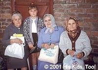These three ladies were pleased at receiving a food bag.