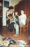 Internot Director helping children with their new sandals.