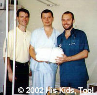 Doctors with some of the donated sheets from His Kids, Too! in Kyiv.