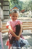 This little girl is very proud of her new clothes, she was adopted 10-04 by a facility worker!