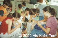 His Kids, Too! Volunteers sort sandals for orphans