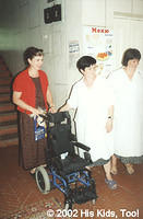 His Kids, Too! Director, Teresa Fillmon presenting one of the six wheel chairs donated by Whitmyer Biomechanix, Inc. to Orthoped