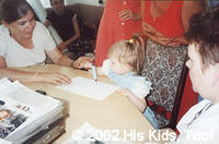 Special thanks to Joe and Annette Northrop for the orthopedic equipment to aide this child to write and feed herself.