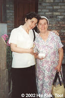 Local church member Valentina gives a warm hug to a widow, recipient of a food bag. We mourn the passing of our sister Valentina