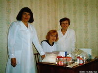 The hospital director, head nurse and inventory clerk are pleased with the medicine donation.