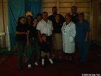 Director with His Kids, Too! volunteers.