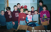 These children are thrilled at the chance to look through boxes of just arrived clothing.