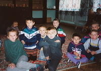 These children are waiting to watch a new video we brought for them.