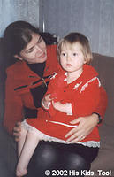His Kids, Too! founder Teresa Fillmon speaks with one of the adorable special needs children.